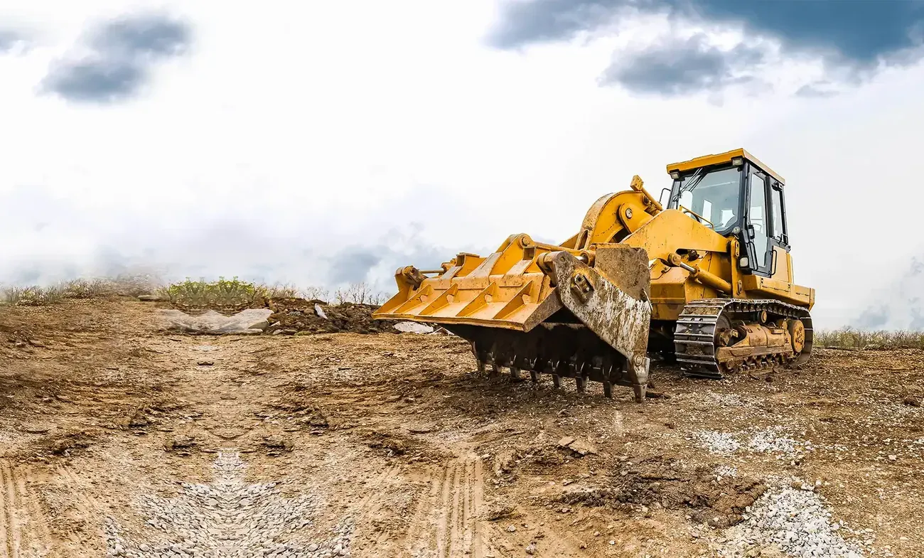 Bulldozer preparing a cleared construction site