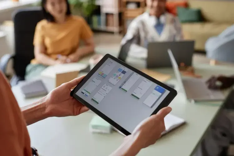 Advisor presenting deal financials on a tablet