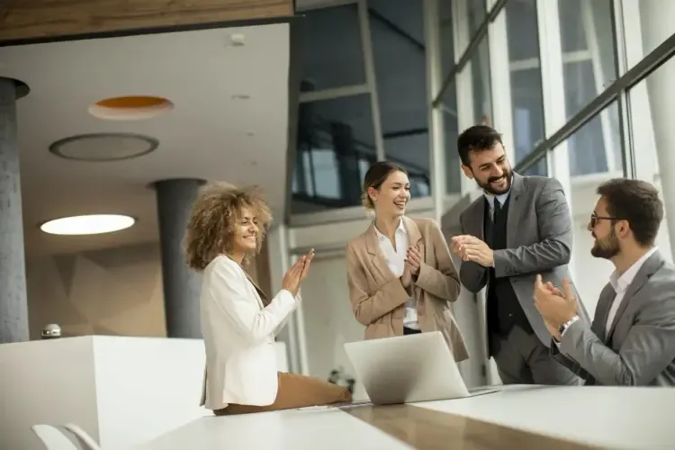 Business team celebrating a successful transition