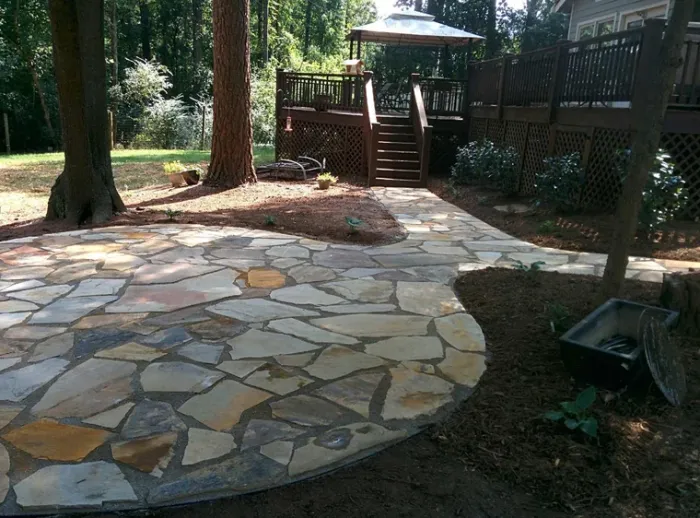Flagstone patio and steps shaded by established trees