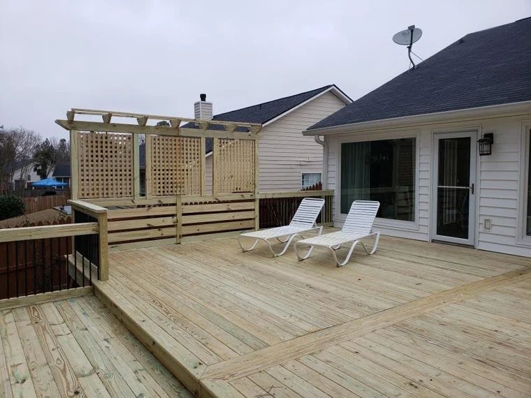 Wood deck with outdoor seating and timber pergola