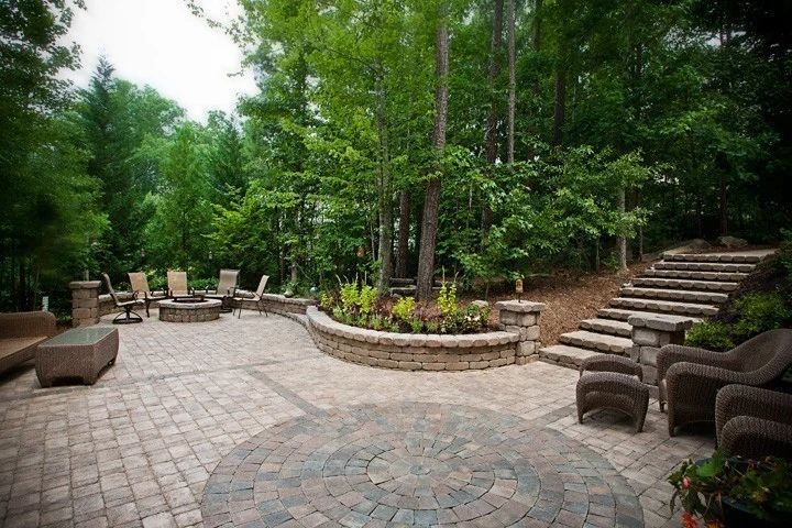 Finished paver terrace with outdoor seating and curving garden walls