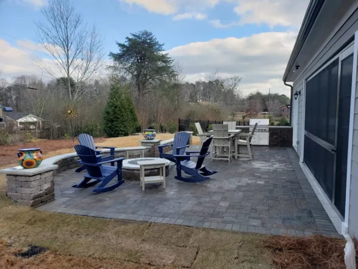 Furnished paver patio with a fire pit and outdoor dining area