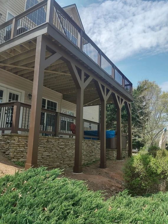 Raised deck with substantial framing above a landscaped hillside