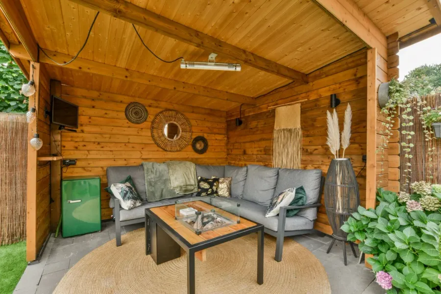 Timber garden pavilion furnished for relaxed outdoor seating