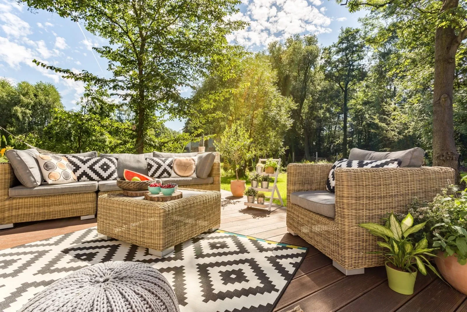 Comfortable outdoor lounge seating on a sunny garden terrace