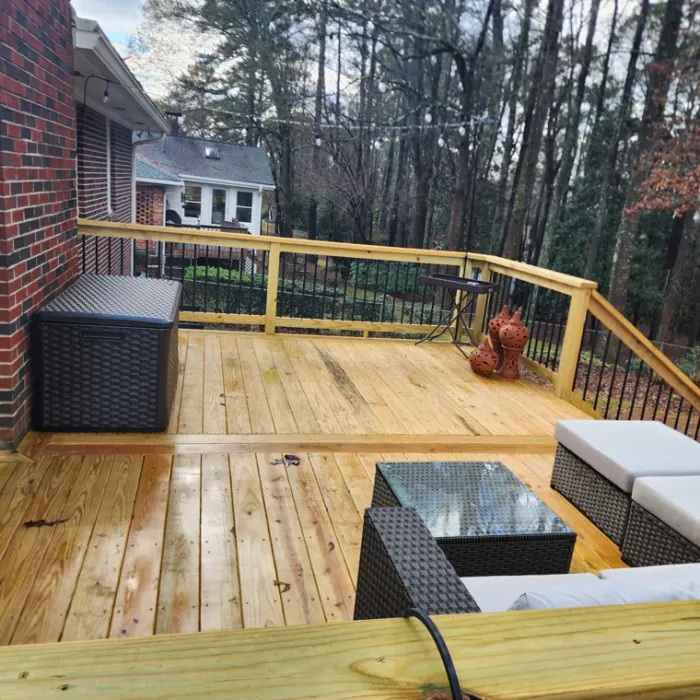 Wood deck with comfortable outdoor seating and black metal railings