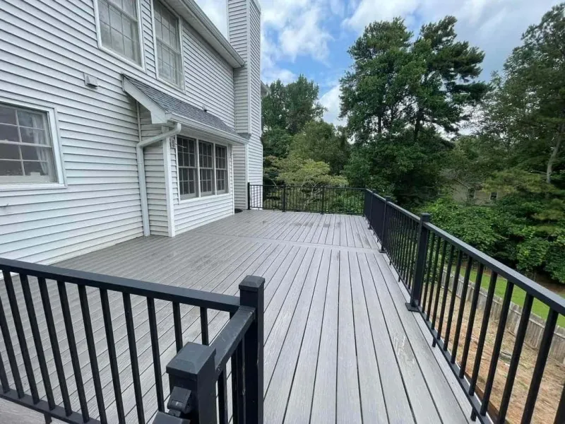 Expansive composite deck with black metal railings