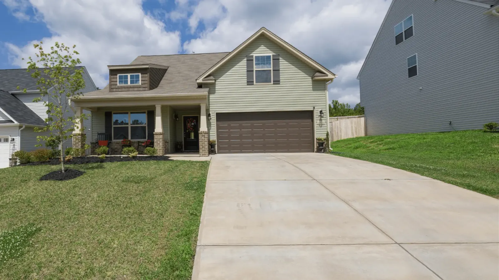 Concrete driveway leading to a residential garage