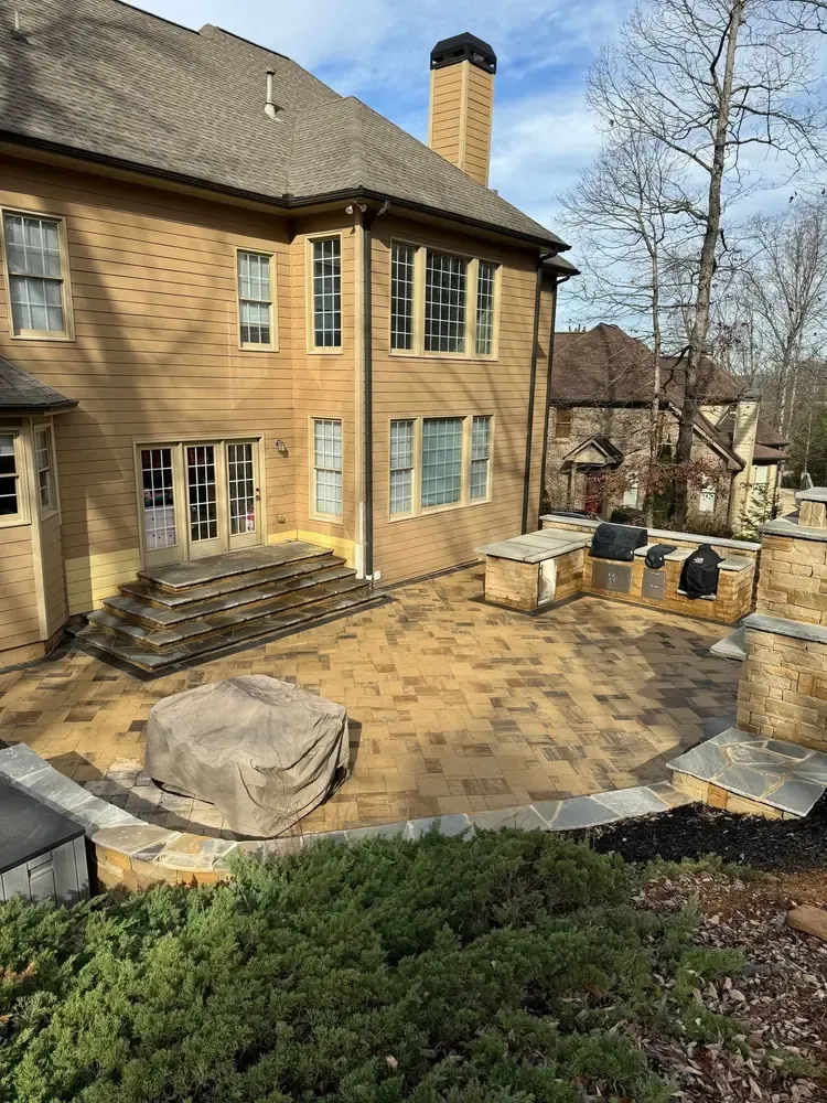 Patio and cooking area behind a home