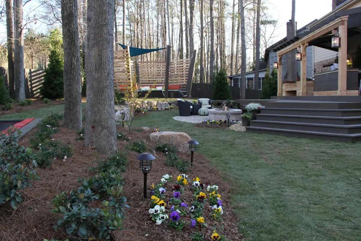 Woodland planting and steps beside an outdoor living area