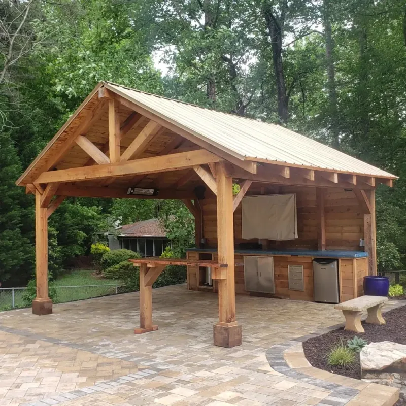 Timber pavilion with a built-in outdoor cooking area
