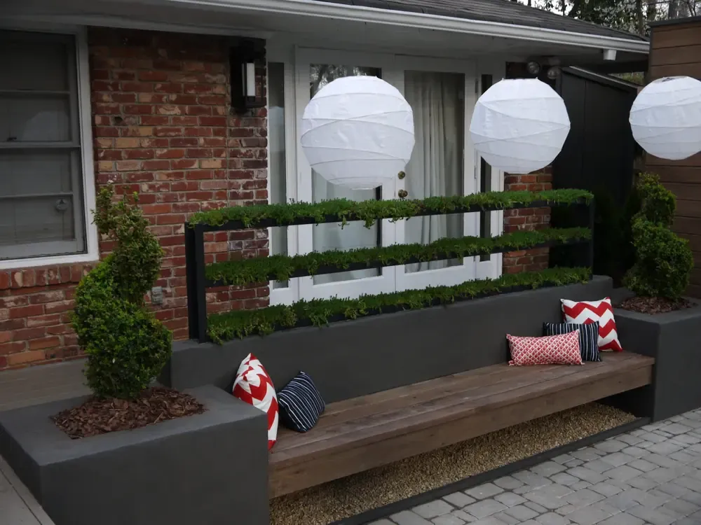 Layered plants framing a built-in outdoor bench