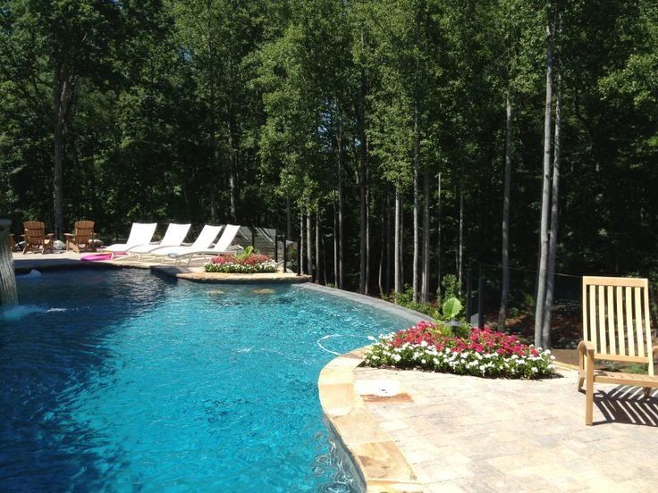 Custom pool with spa and woodland patio