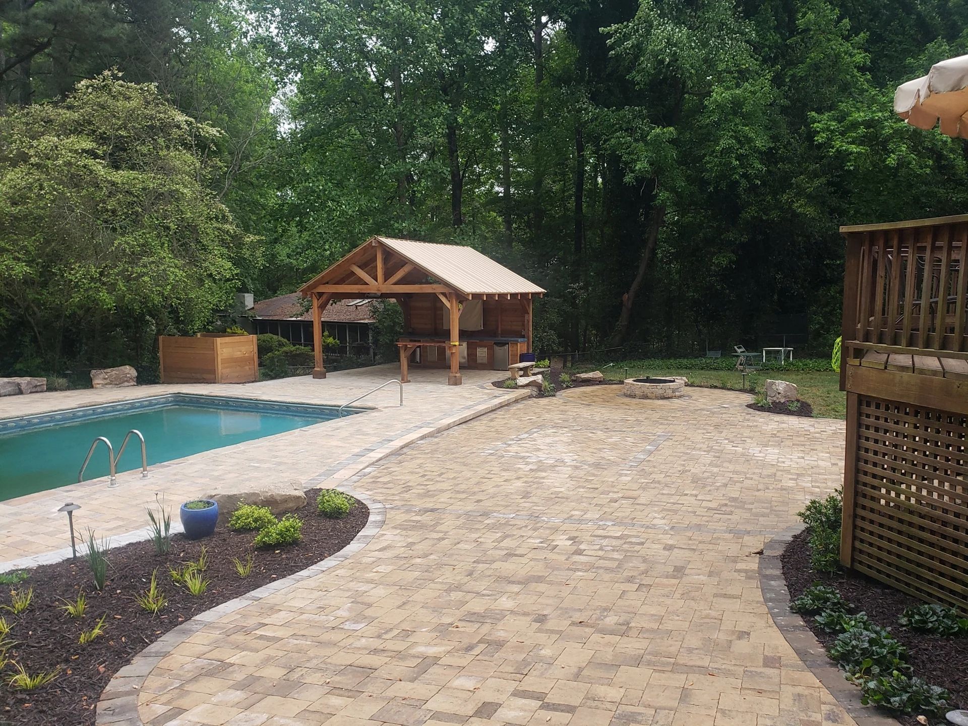 Pool, patio, and timber pavilion