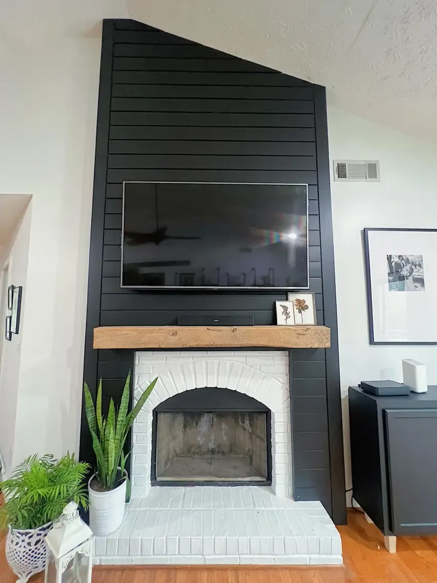 Black shiplap fireplace & oak mantel