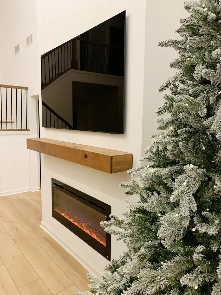 Oak mantel & white fireplace wall