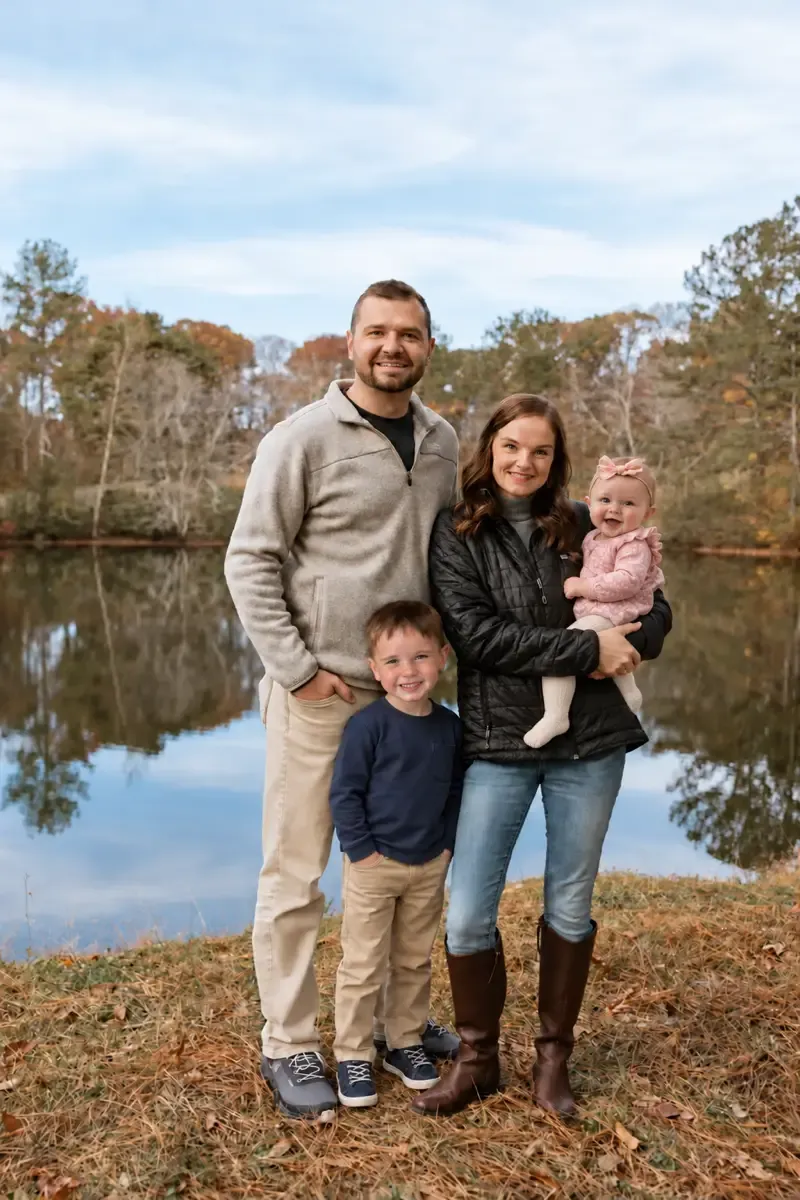 Drew Dempsey with his wife and child